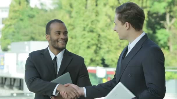 Two confident businessman handshake - Footage, Video