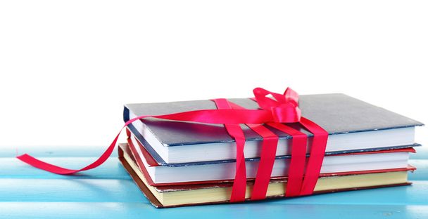 Stack of books with ribbon - 写真・画像