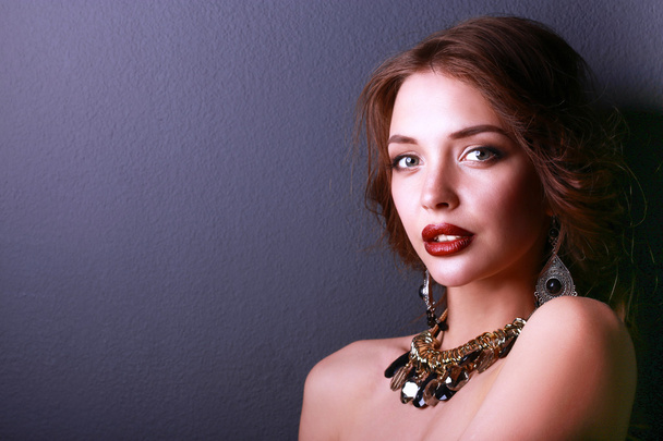 Portrait of young beautiful woman with jewelry - Foto, Imagem
