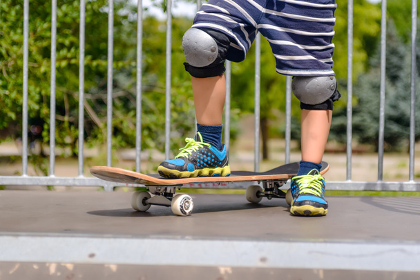 Young boy with his skateboard on a ramp - Photo, Image
