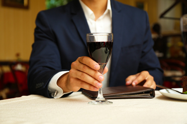 Young attractive man at restaurant - Foto, afbeelding