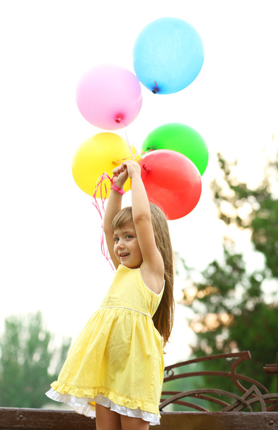 Little girl with balloons   - Valokuva, kuva
