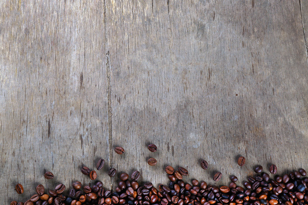Coffee beans on table - Foto, afbeelding
