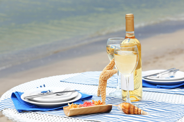 Served decorated table on sea background - Foto, Imagem