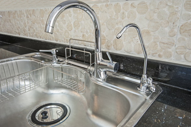 Closeup of a metal kitchen sink - Photo, Image