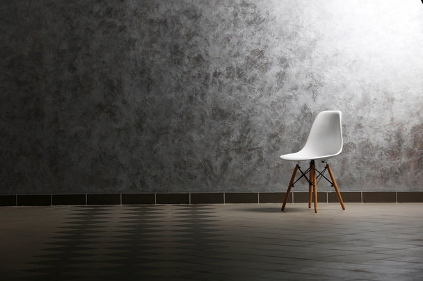 Chair on grey wall background - Photo, Image
