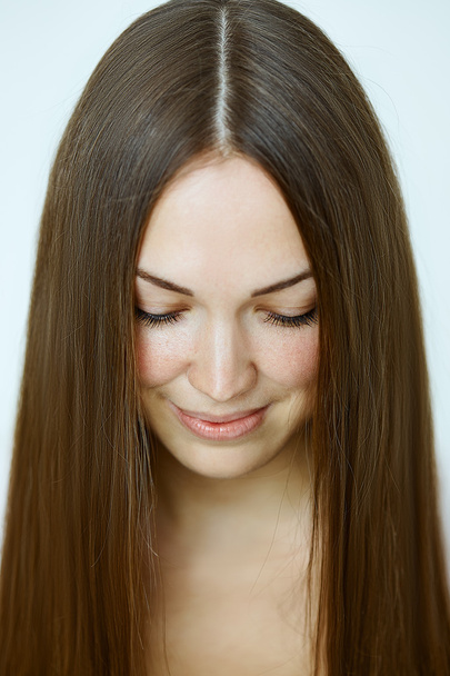 Portrait of a young woman with straight hair - Фото, изображение
