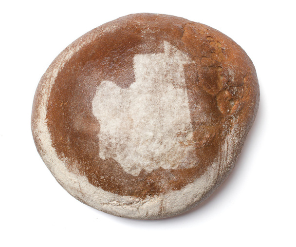 A loaf of fresh bread covered with rye flour in the shape of Mau - Фото, зображення