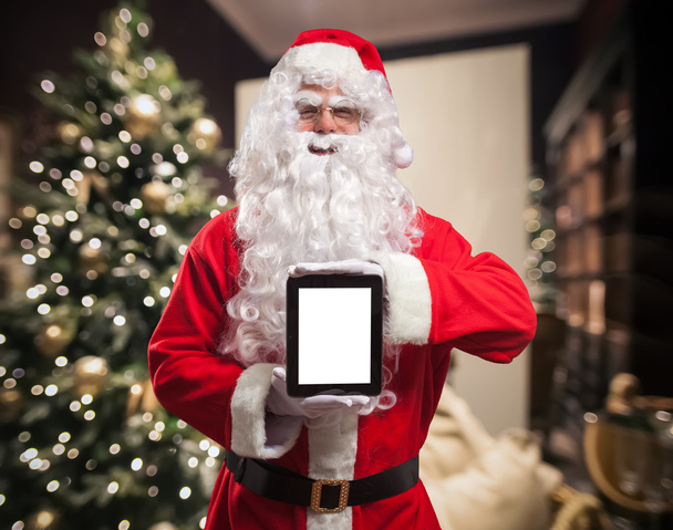Père Noël tenant une tablette numérique
 - Photo, image