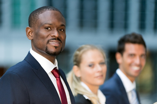 african businessman in front of his team - Photo, Image