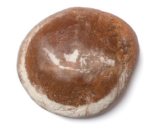 ein Laib frisches Brot, bedeckt mit Roggenmehl in Form von Rinde - Foto, Bild