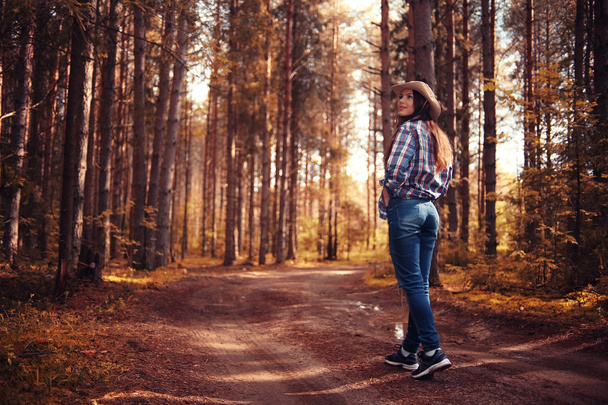 Young girl in the forest ranger - Φωτογραφία, εικόνα