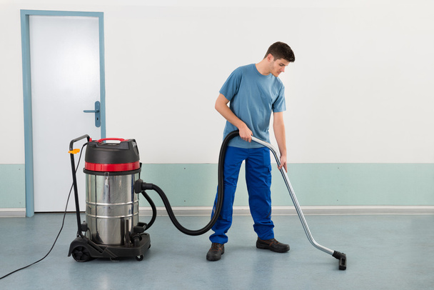 Male Worker With Vacuum Cleaner - Valokuva, kuva