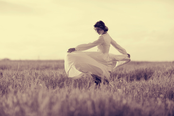 girl in white dress fall outside - Фото, изображение