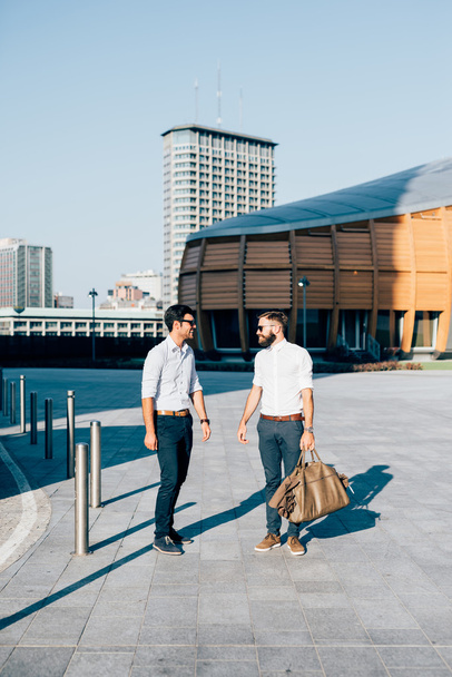 Two modern businessmen posing in the city - Photo, image