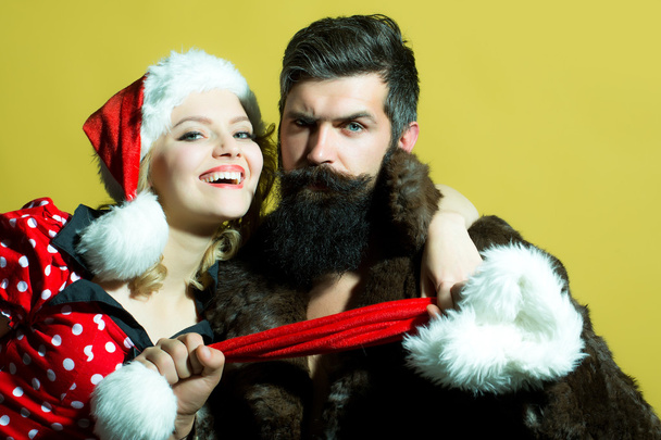 Christmas couple in studio - Foto, afbeelding