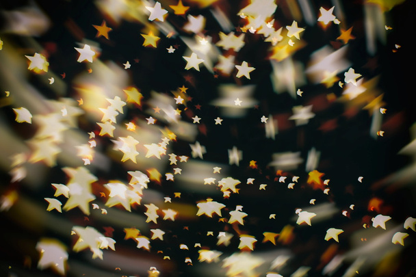 ボケの光と星の質感を持つ祭りエレガントな抽象的な背景 - 写真・画像