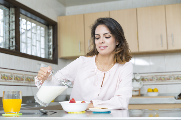 Attractive woman having breakfast - Фото, изображение