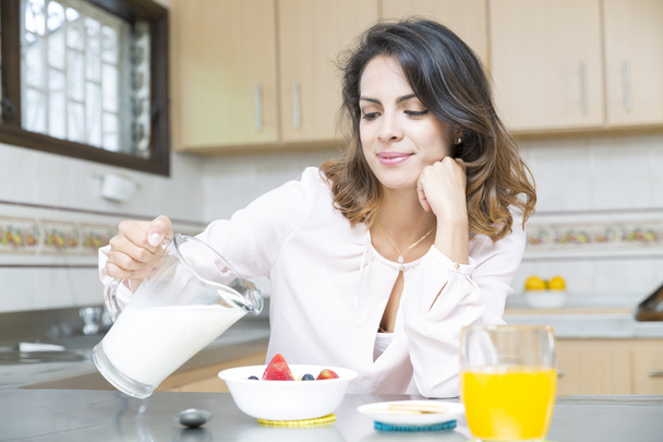 Attractive woman having breakfast - Fotó, kép