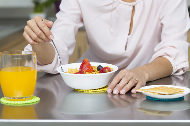 Attractive woman having breakfast - Фото, зображення