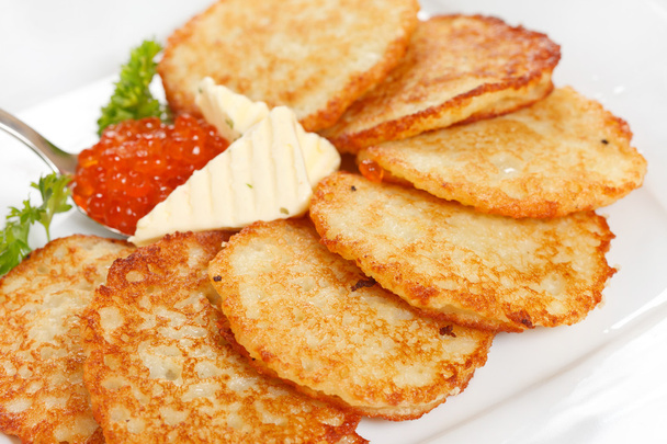 Fried potatoes pancakes with caviar - Fotoğraf, Görsel