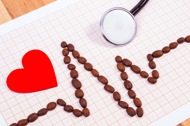 Cardiogram line of coffee grains, stethoscope and red heart, medicine and healthcare concept - Фото, изображение
