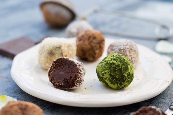 Chocolate truffles on white dish - Photo, Image