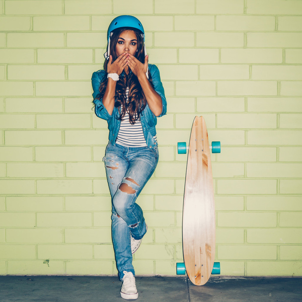 hipster beautiful girl with skateboard - 写真・画像