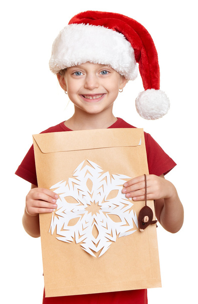 girl in red hat with letter to santa - winter holiday christmas concept - Фото, зображення