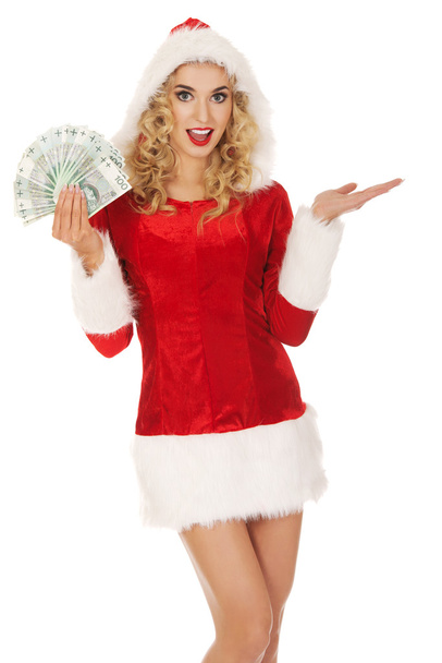 Beautiful santa woman holding a clip of polish money - Foto, Imagem