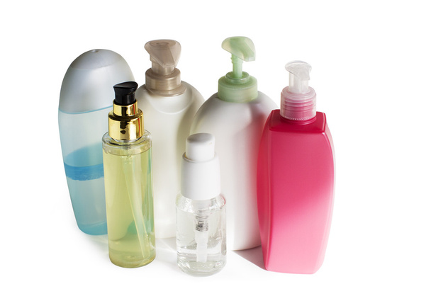 gekleurde plastic flessen met batcher - Foto, afbeelding