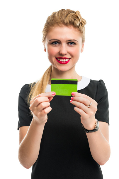Portrait of a beautiful young smiling woman with a bank card. - Photo, Image