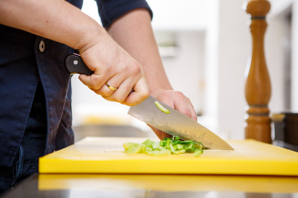 Chef chopping greens - Photo, Image
