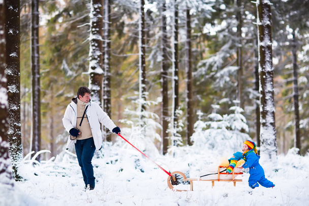 Father and children playing in snow - Fotoğraf, Görsel