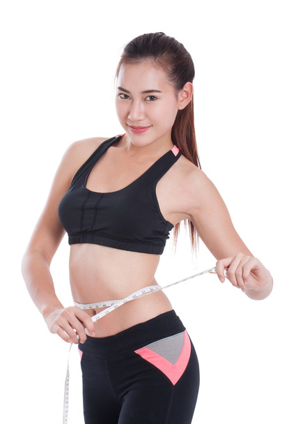 Fitness young woman with measuring tape - Foto, immagini