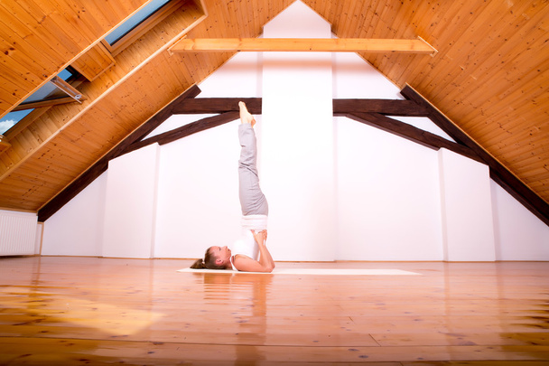Woman practicing Yoga in a Studio - Foto, Bild
