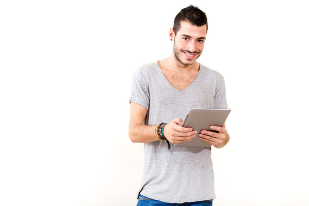 Young man using tablet - 写真・画像