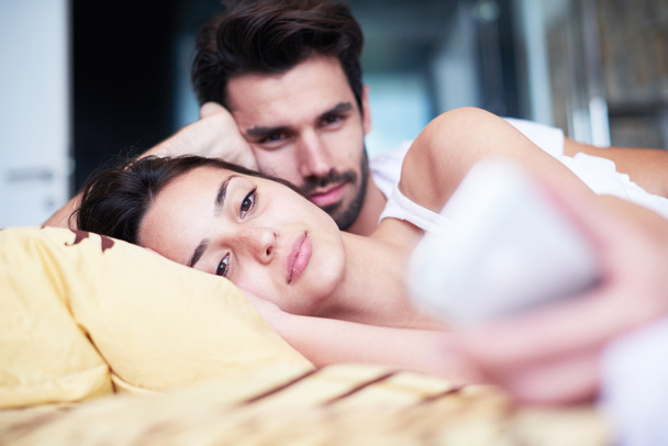 couple relaxing in bed - Photo, Image