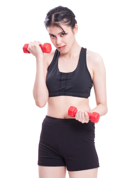 Sport woman exercising with dumbbells - Фото, изображение