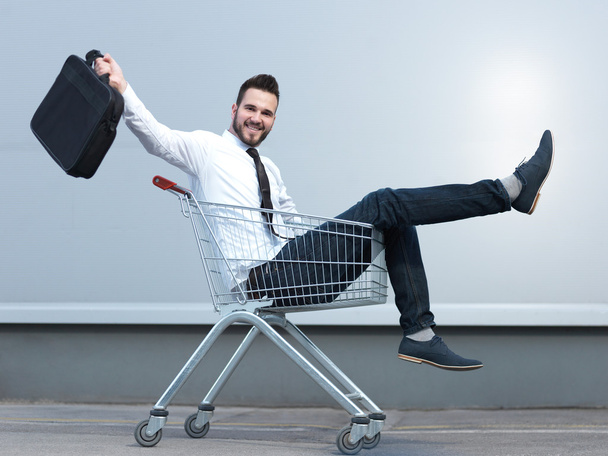 businessman driving in the shopping cart - Photo, image