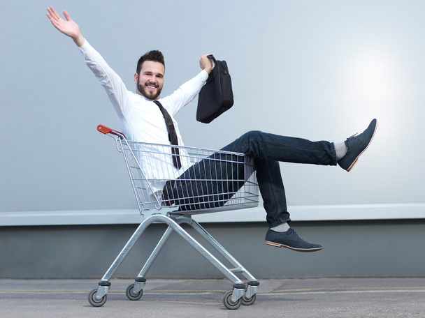 businessman driving in the shopping cart - Photo, image