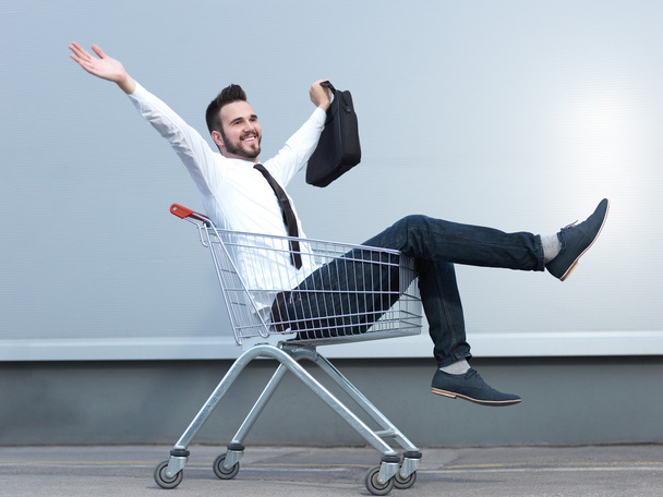 businessman driving in the shopping cart - Fotó, kép