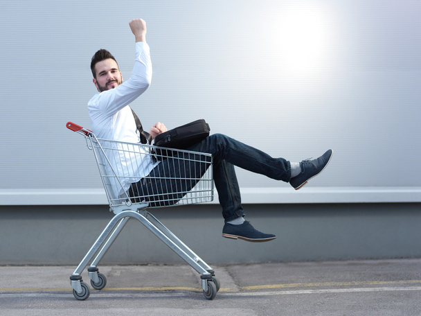 businessman driving in the shopping cart - Foto, Imagen