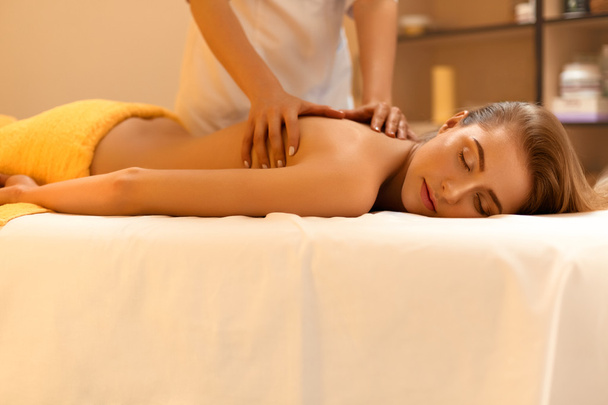 Spa Massage. Beautiful Blonde Gets Spa Treatment in Salon. - Fotografie, Obrázek