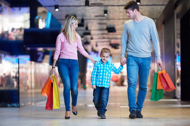 young family with shopping bags - Foto, imagen