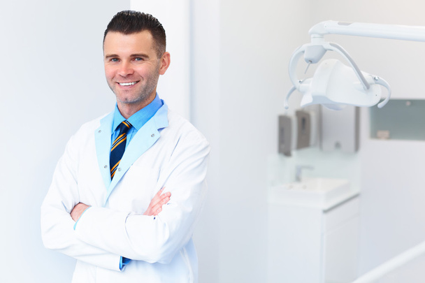 Dentist Doctor Portrait. Young Man at His Workplace. Dental Clin - Фото, изображение
