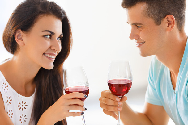 Young couple drinking wine. Romantic relationship. - Фото, зображення