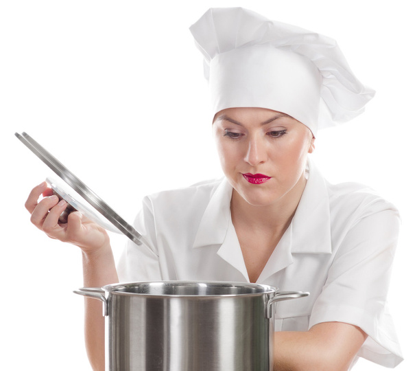 鍋と女性シェフの料理. - 写真・画像