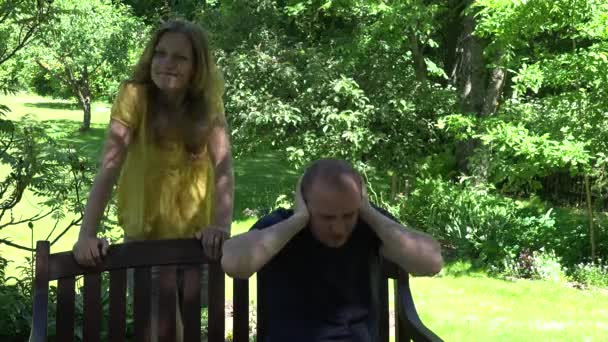 woman accuses husband of broken promises. Couple in green park. 4K - Video, Çekim