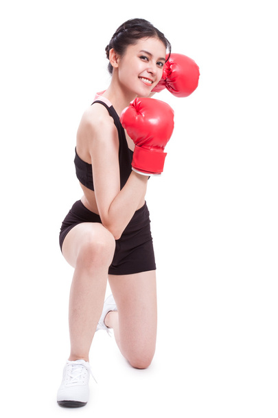 Fitness woman wearing boxing gloves - Fotó, kép
